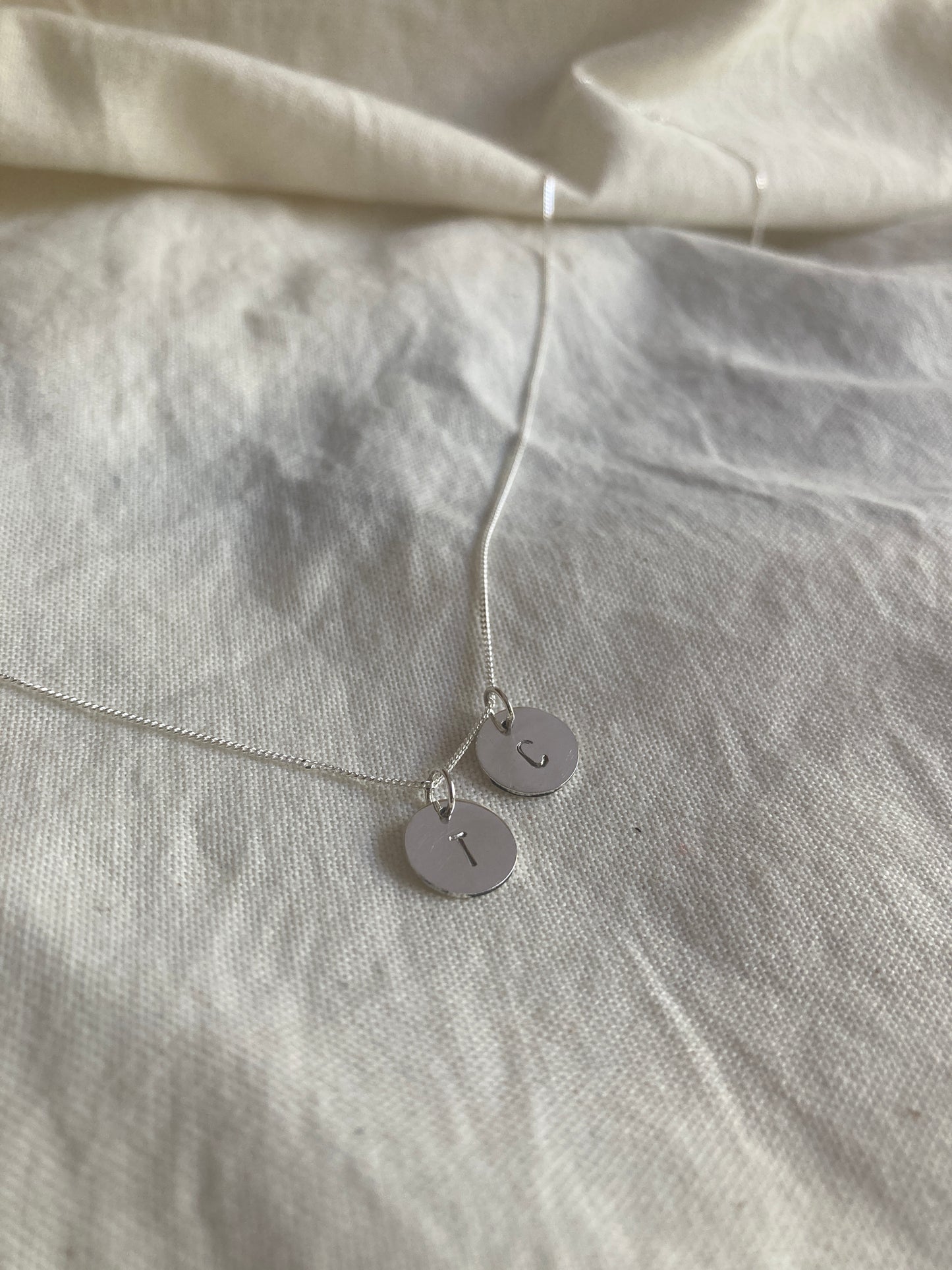 Sterling Silver 9mm Initial Disc Pendant with one additional Initial Disc Charms