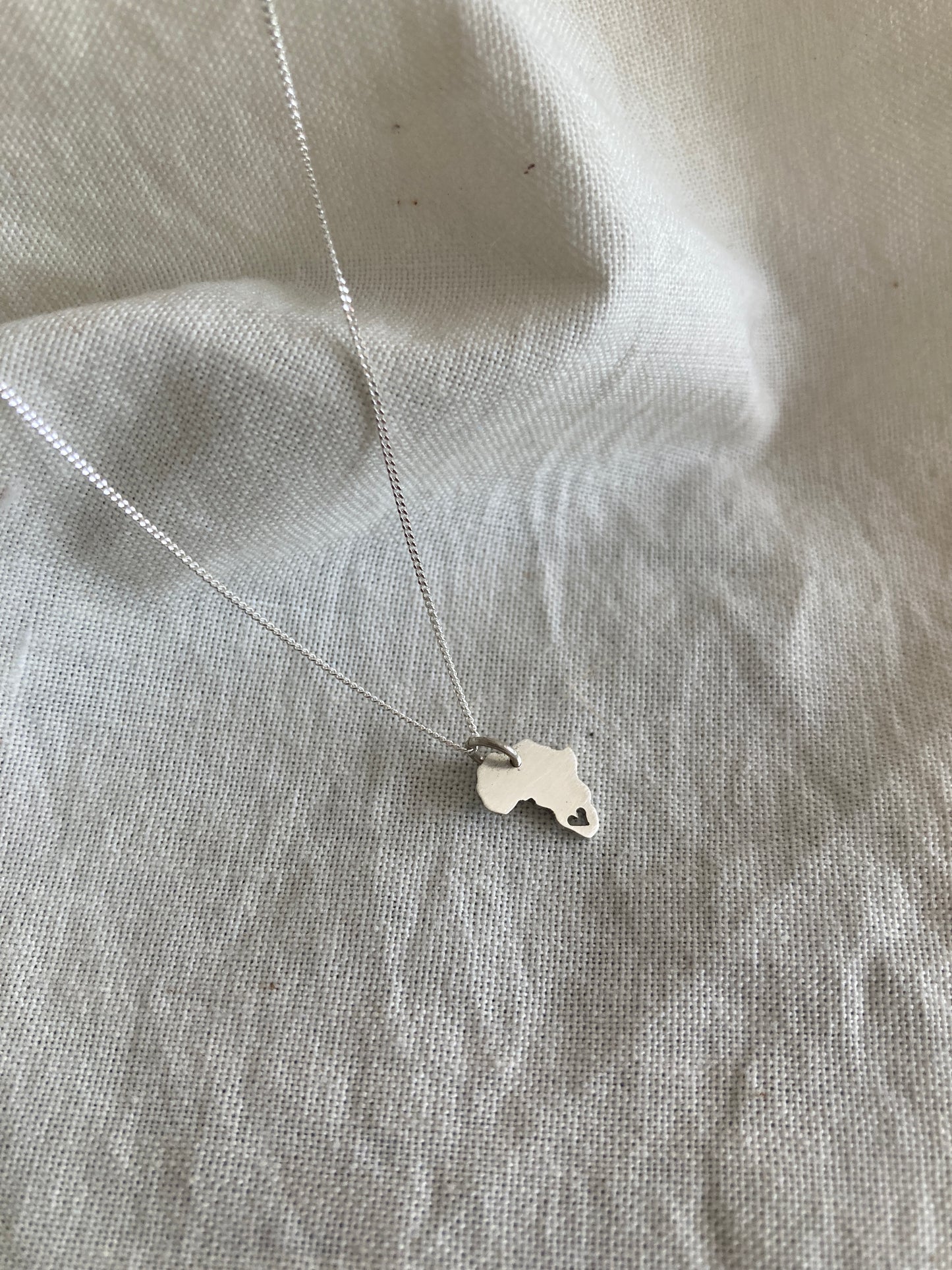 Sterling Silver Africa Charm with cut out Heart on Silver Chain