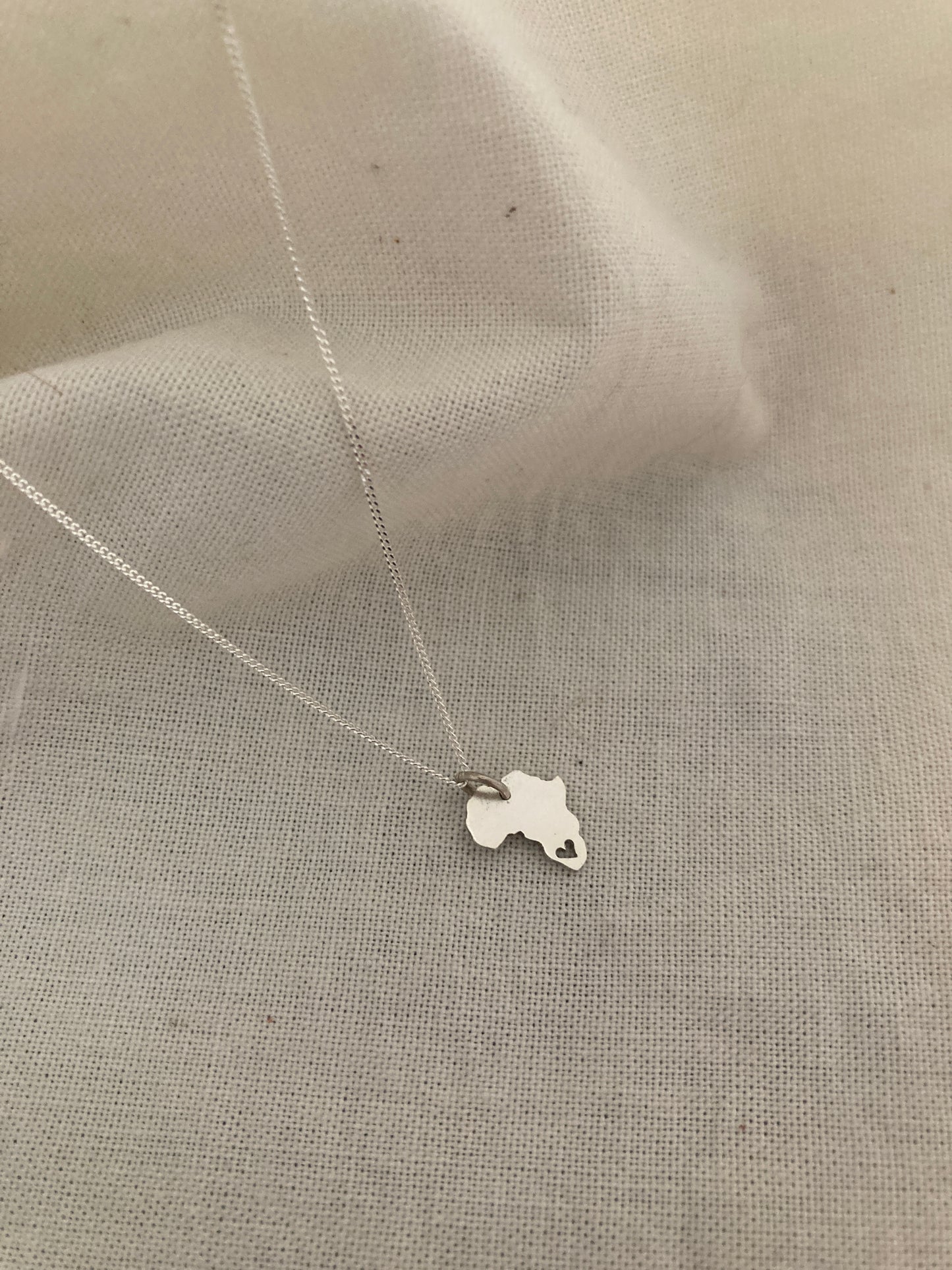 Sterling Silver Africa Charm with cut out Heart on Silver Chain