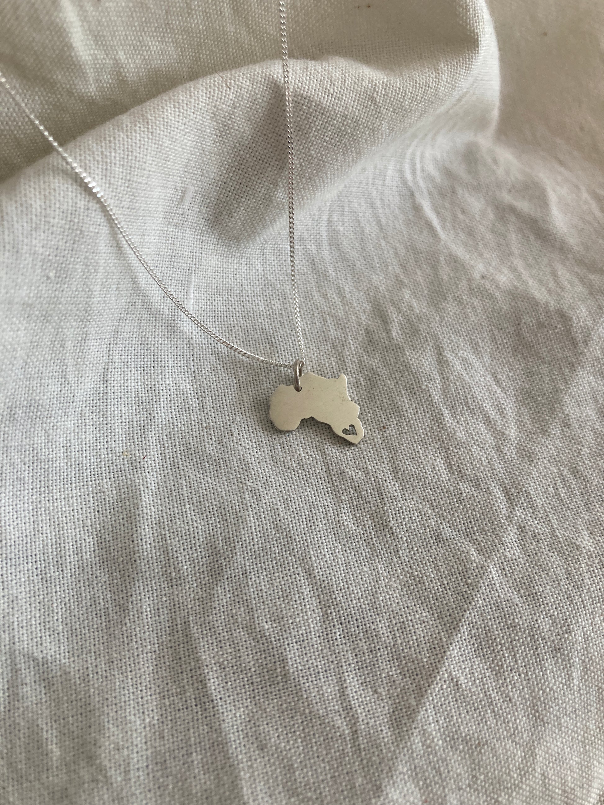 Sterling Silver Africa Pendant with cut out Heart on Silver Chain