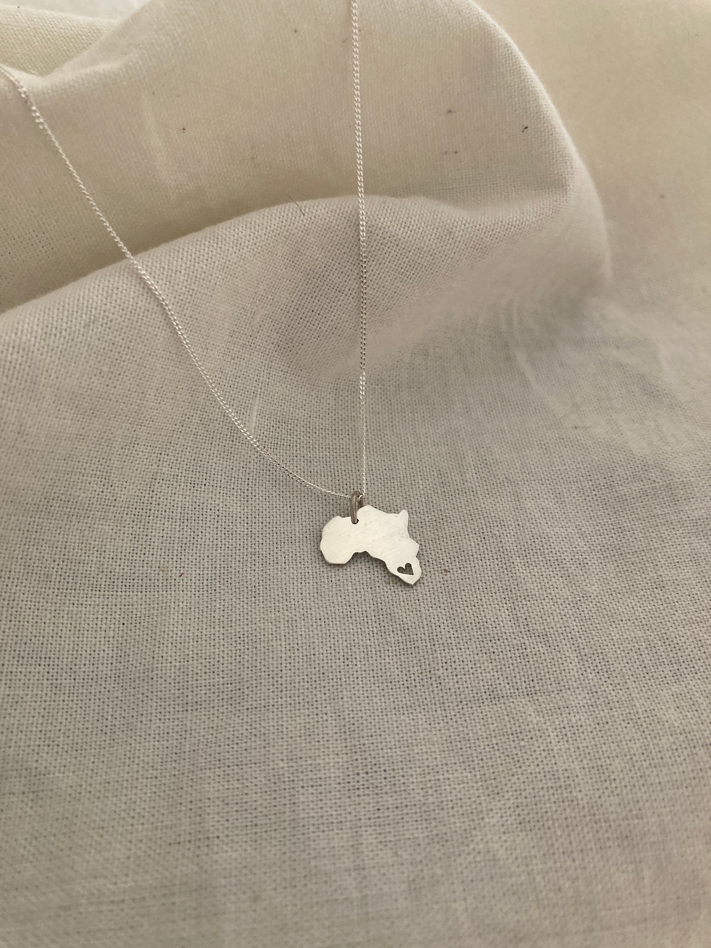 Sterling Silver Africa Pendant with cut out Heart on Silver Chain