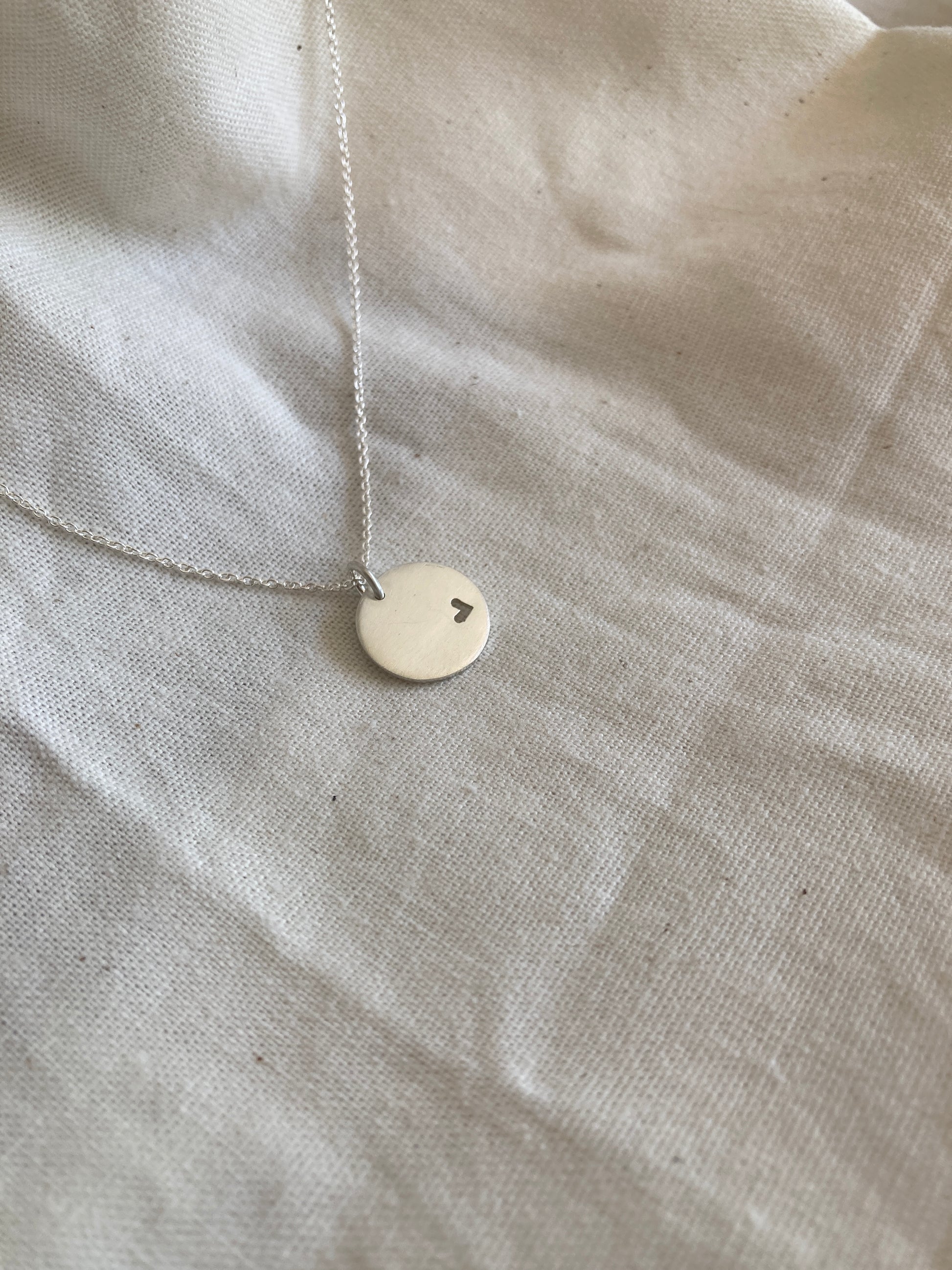 Sterling Silver 13mm Disc Pendant with cut out Heart on Sterling Silver Chain