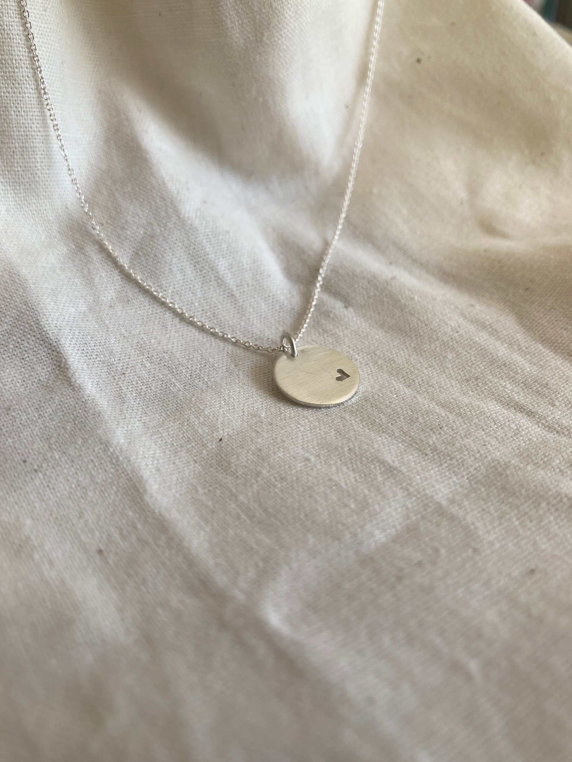 Sterling Silver 13mm Disc Pendant with cut out Heart on Sterling Silver Chain