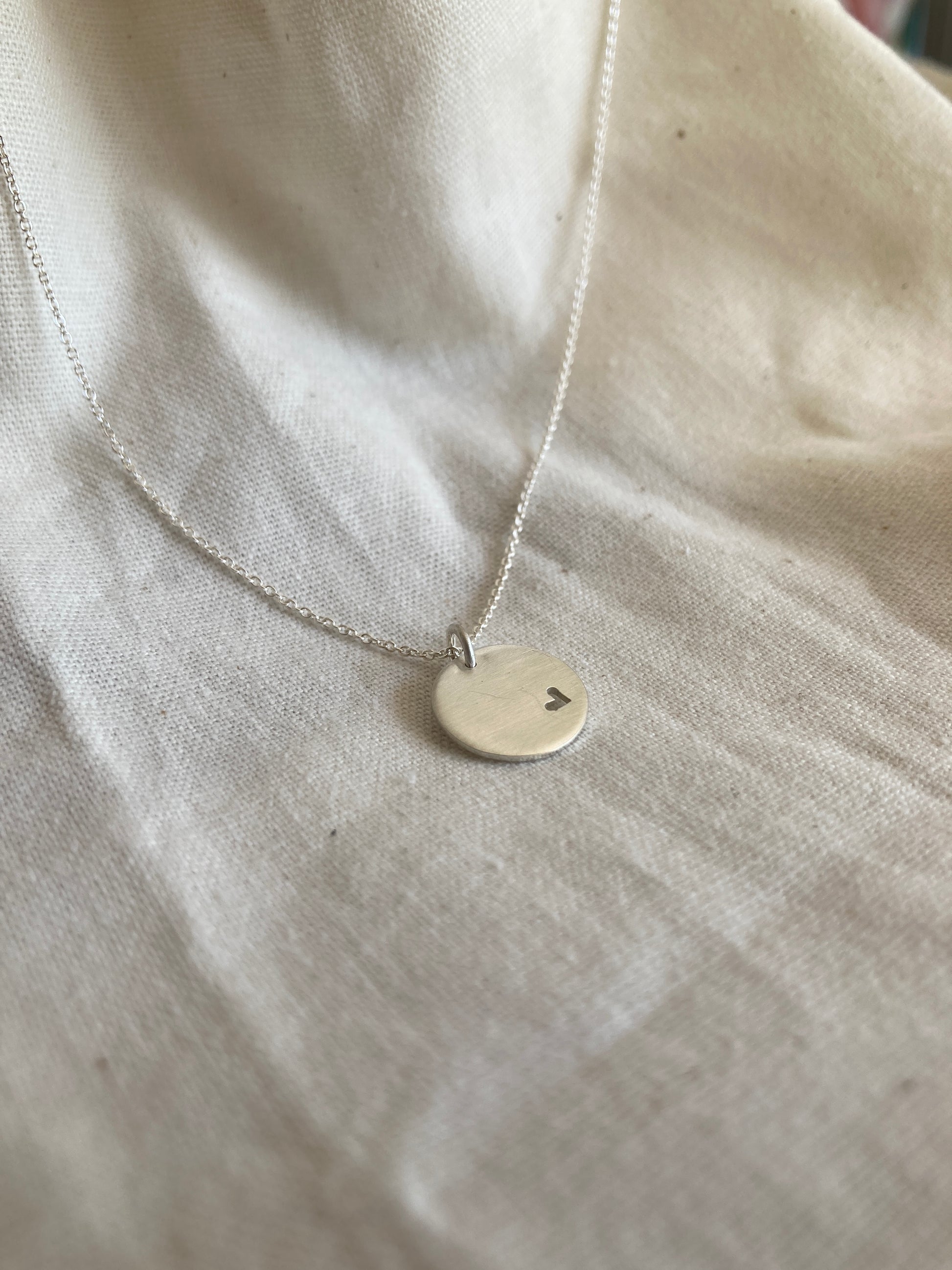 Sterling Silver 13mm Disc Pendant with cut out Heart on Sterling Silver Chain
