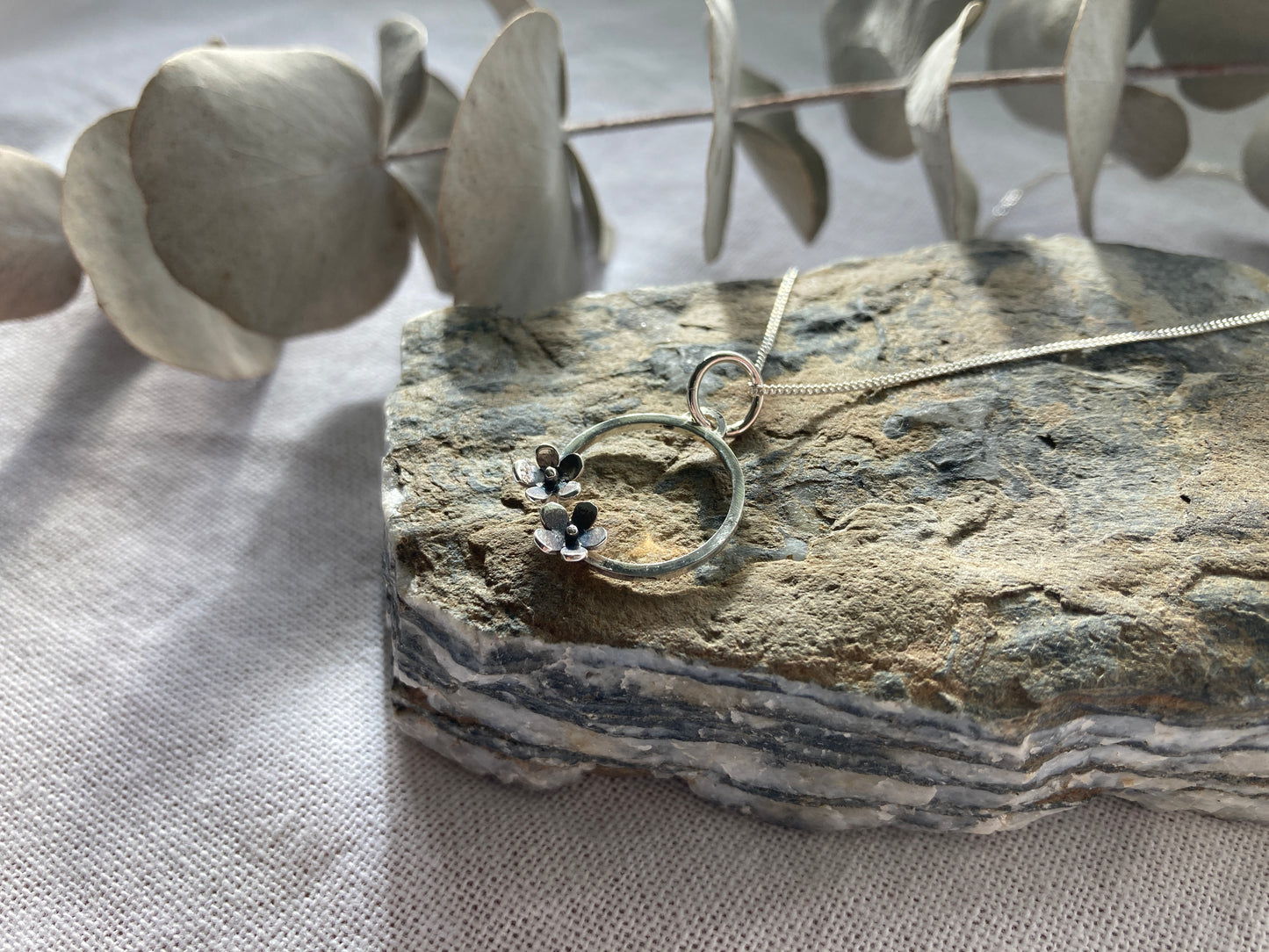 Sterling Silver Circle with two small Blooming Flowers Pendant on Silver Chain