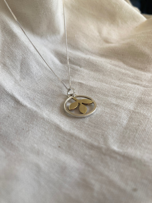 Sterling Silver Circle With Brass Leaves Pendant on Sterling Silver Chain
