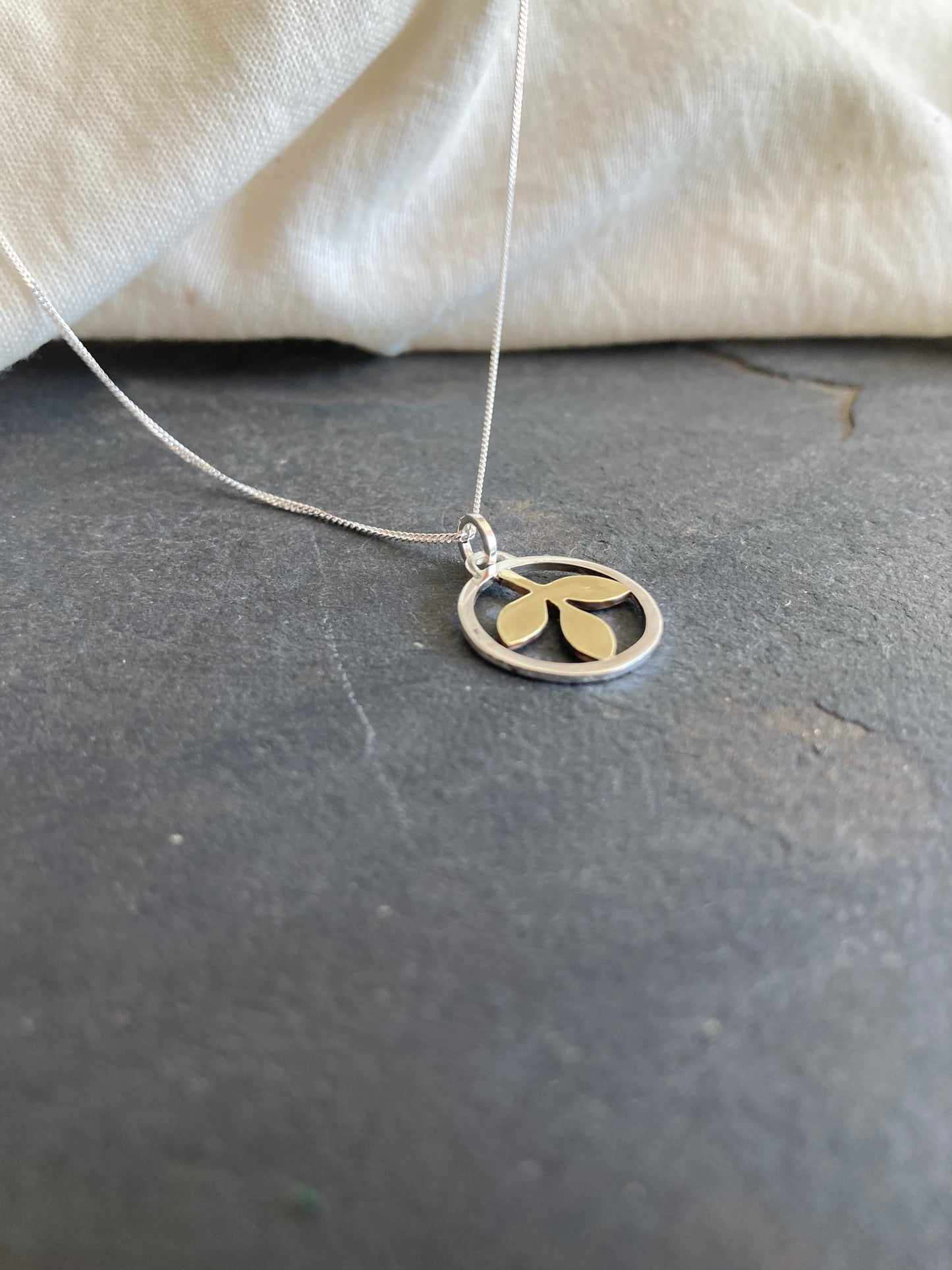 Sterling Silver Circle With Brass Leaves Pendant on Sterling Silver Chain