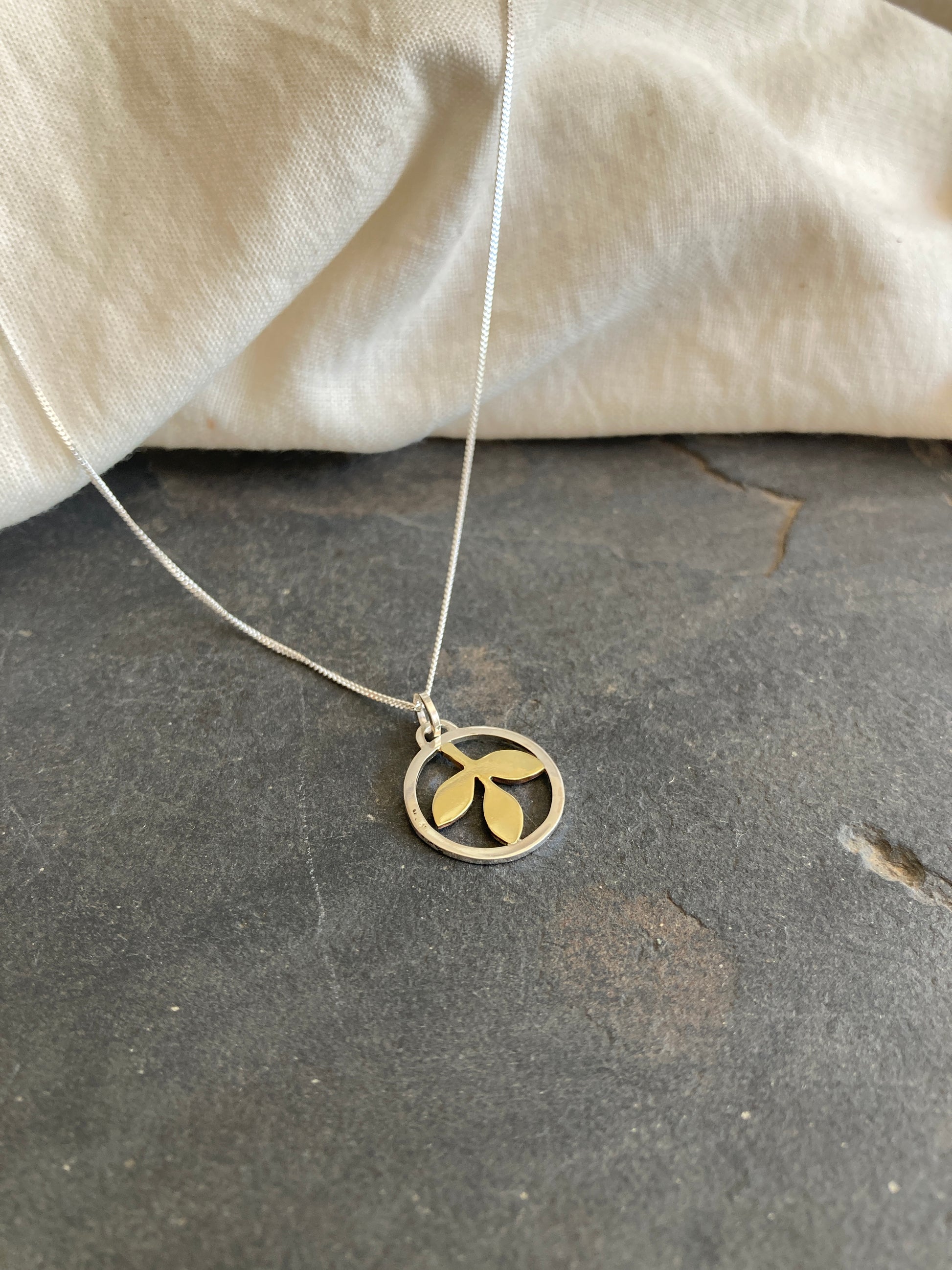 Sterling Silver Circle With Brass Leaves Pendant on Sterling Silver Chain