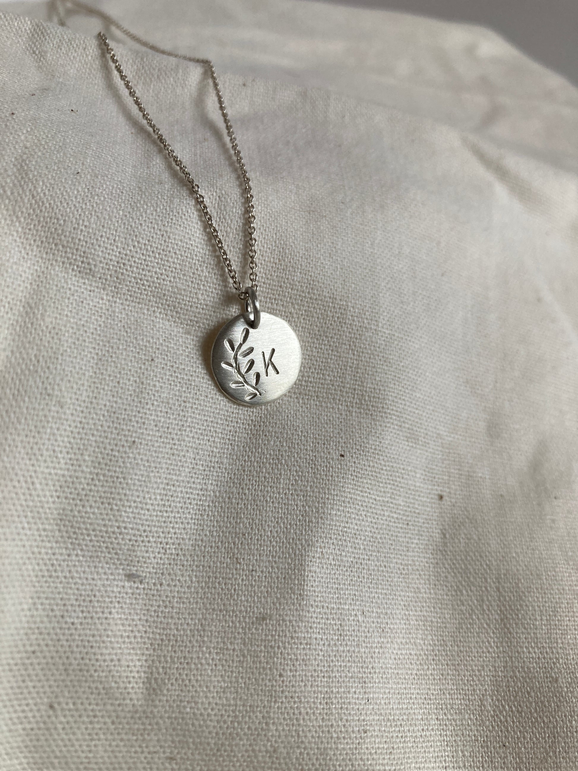 Sterling Silver Disc with Leaves Engraving and hand stamped Initial on Sterling Silver Chain