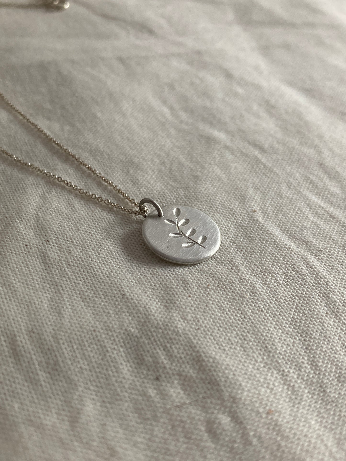 Sterling Silver Disc Pendant with engraved Leaves Design