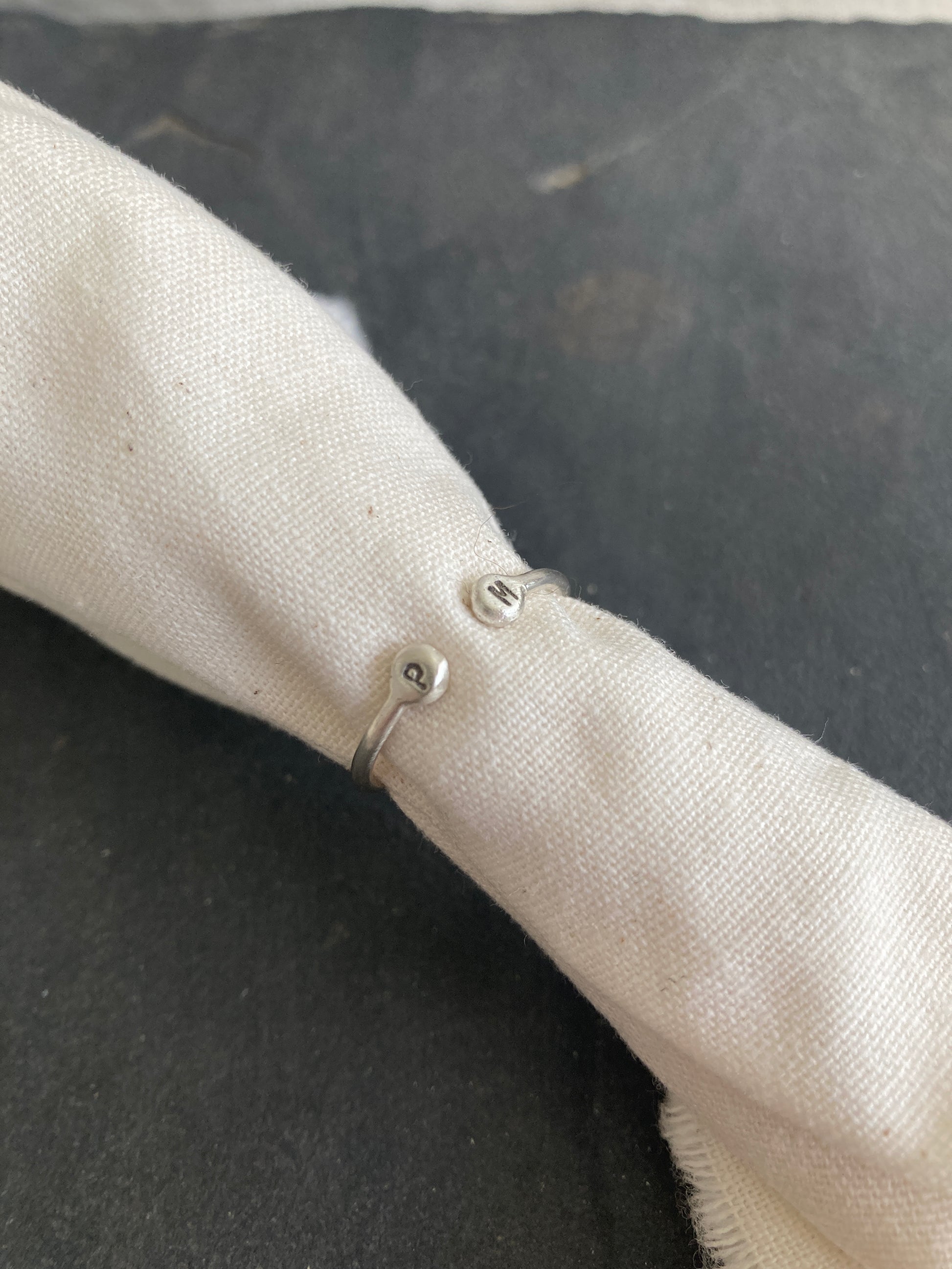 Sterling Silver Open Ring with pebble detail on the ends with hand stamped initials