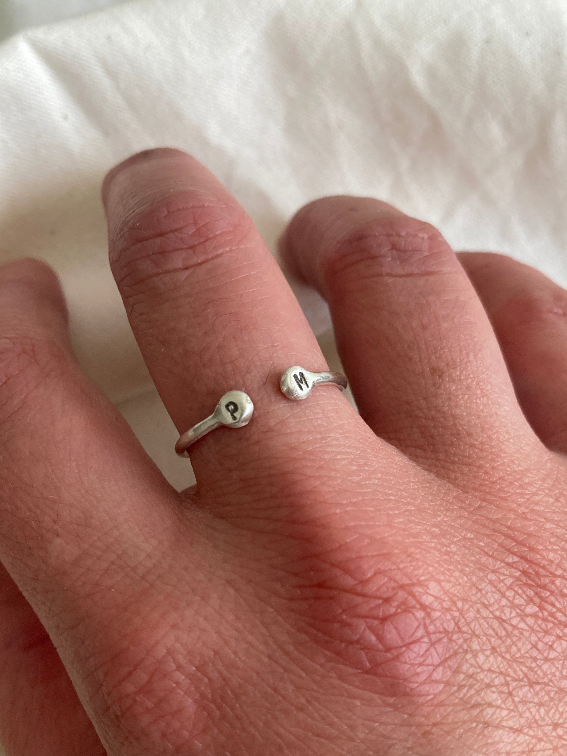 Sterling Silver Open Ring with pebble detail on the ends with hand stamped initials