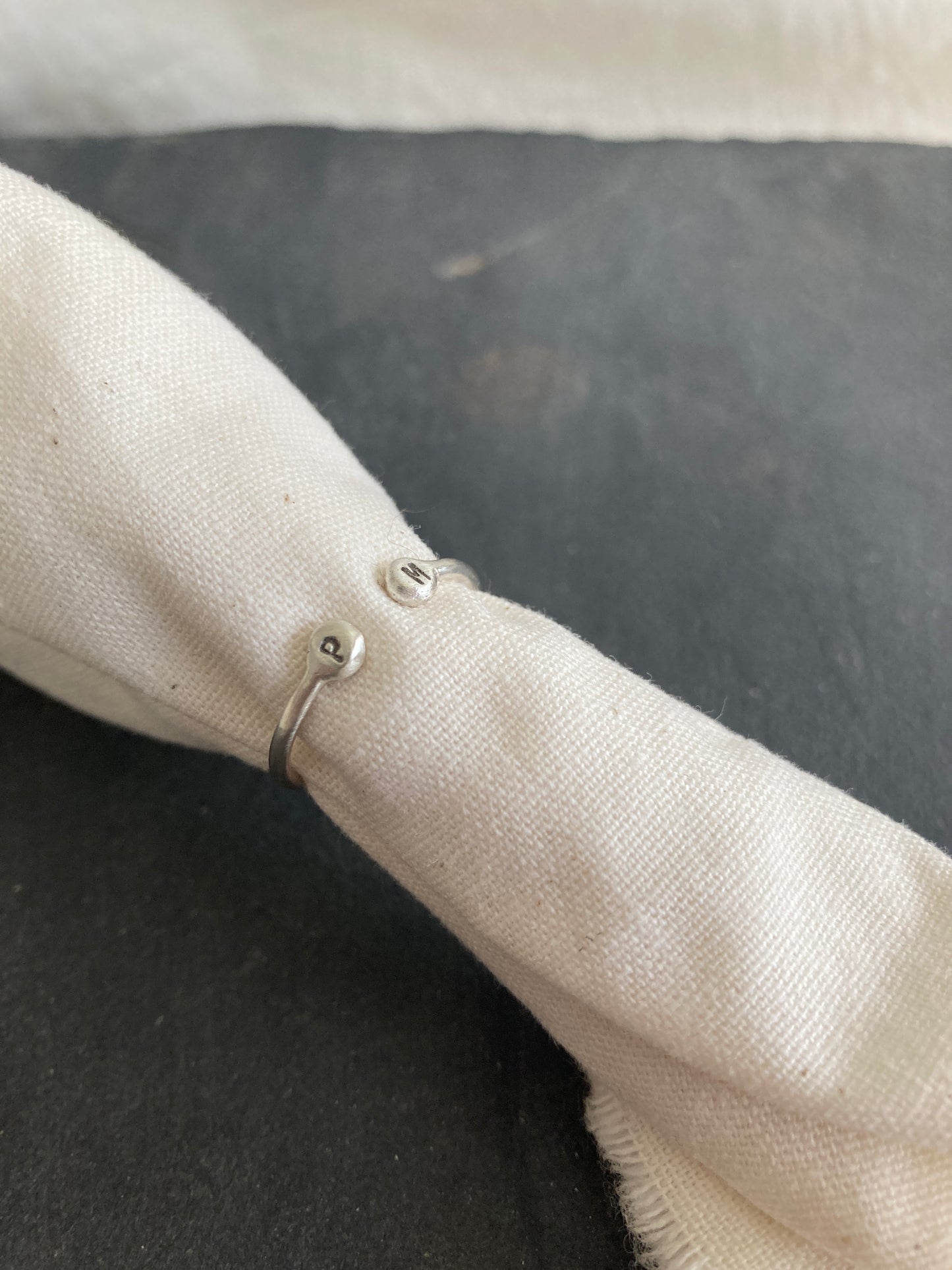 Sterling Silver Open Ring with pebble detail on the ends with hand stamped initials