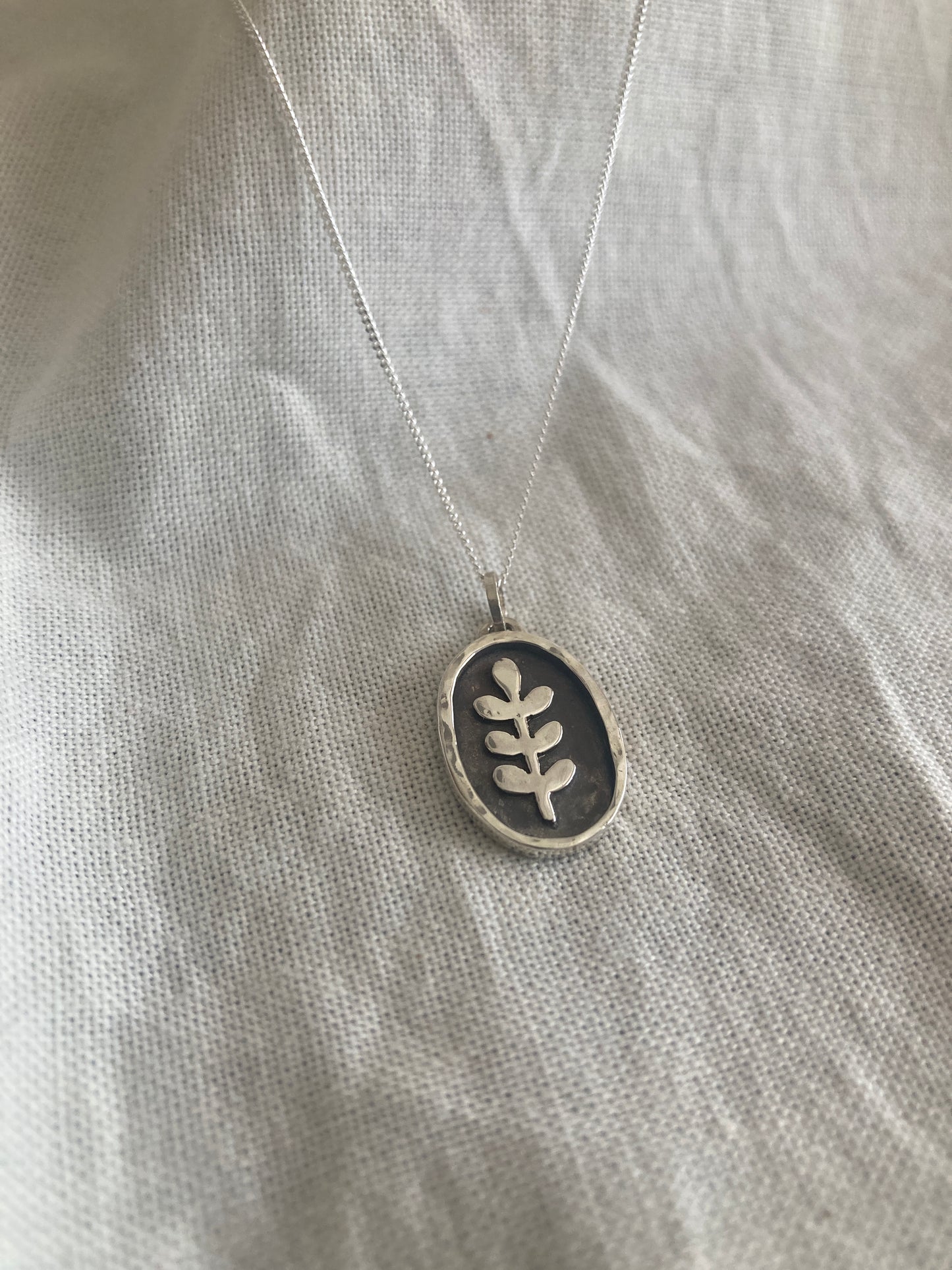 Sterling Silver Oval with Leaves Pendant with oxidised detail