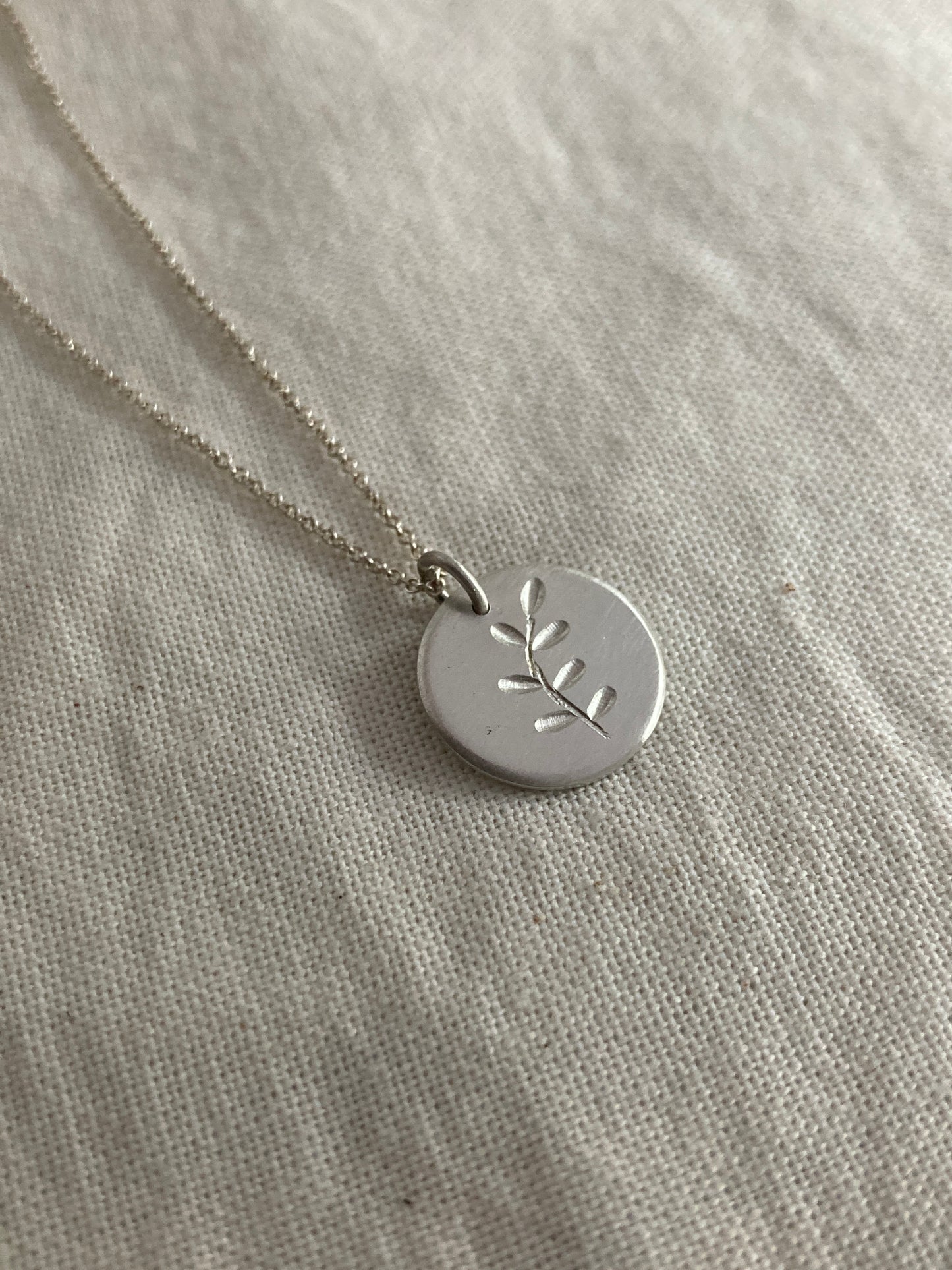 Sterling Silver Disc Pendant with engraved Leaves Design