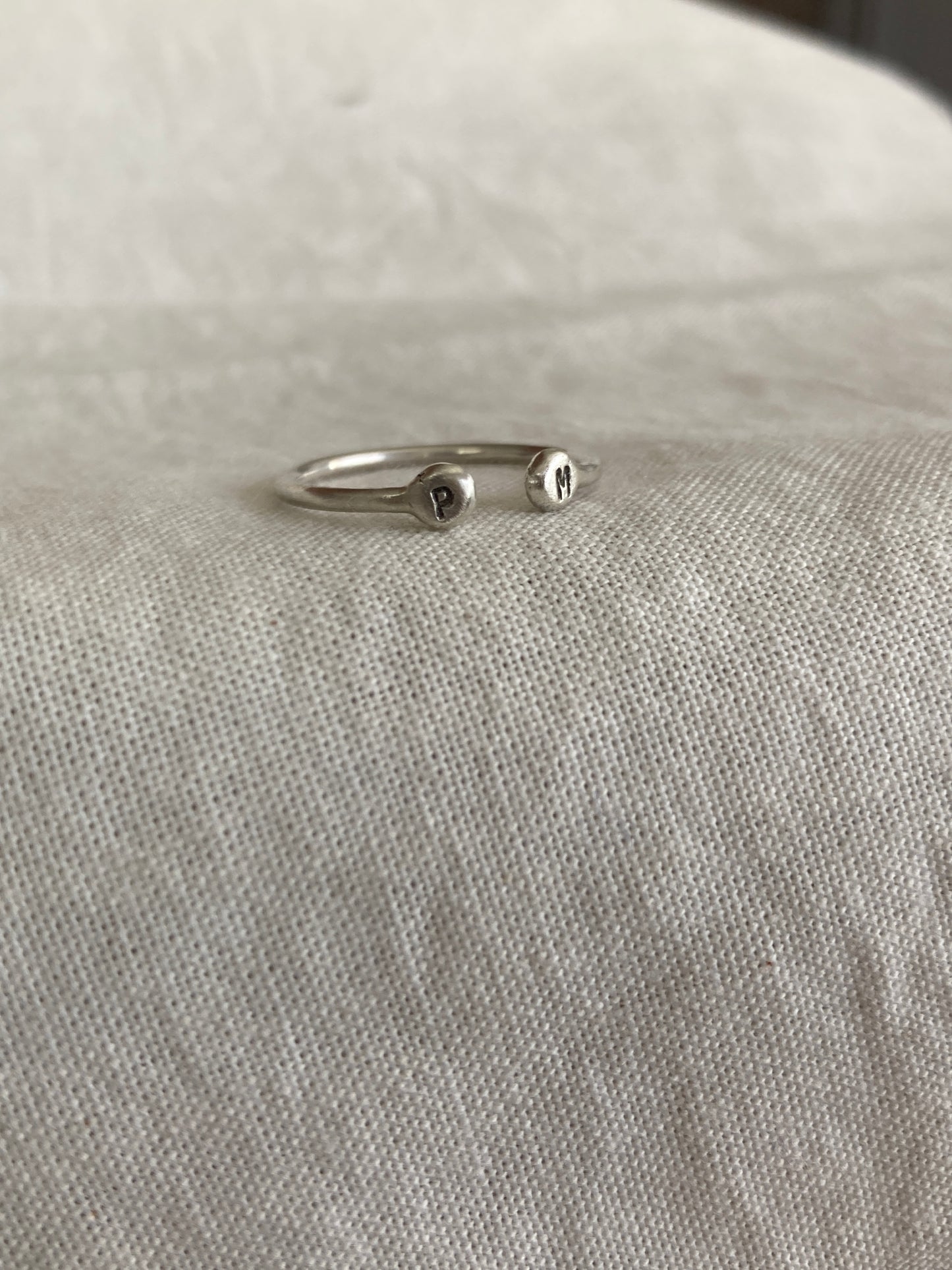 Sterling Silver Open Ring with pebble detail on the ends with hand stamped initials