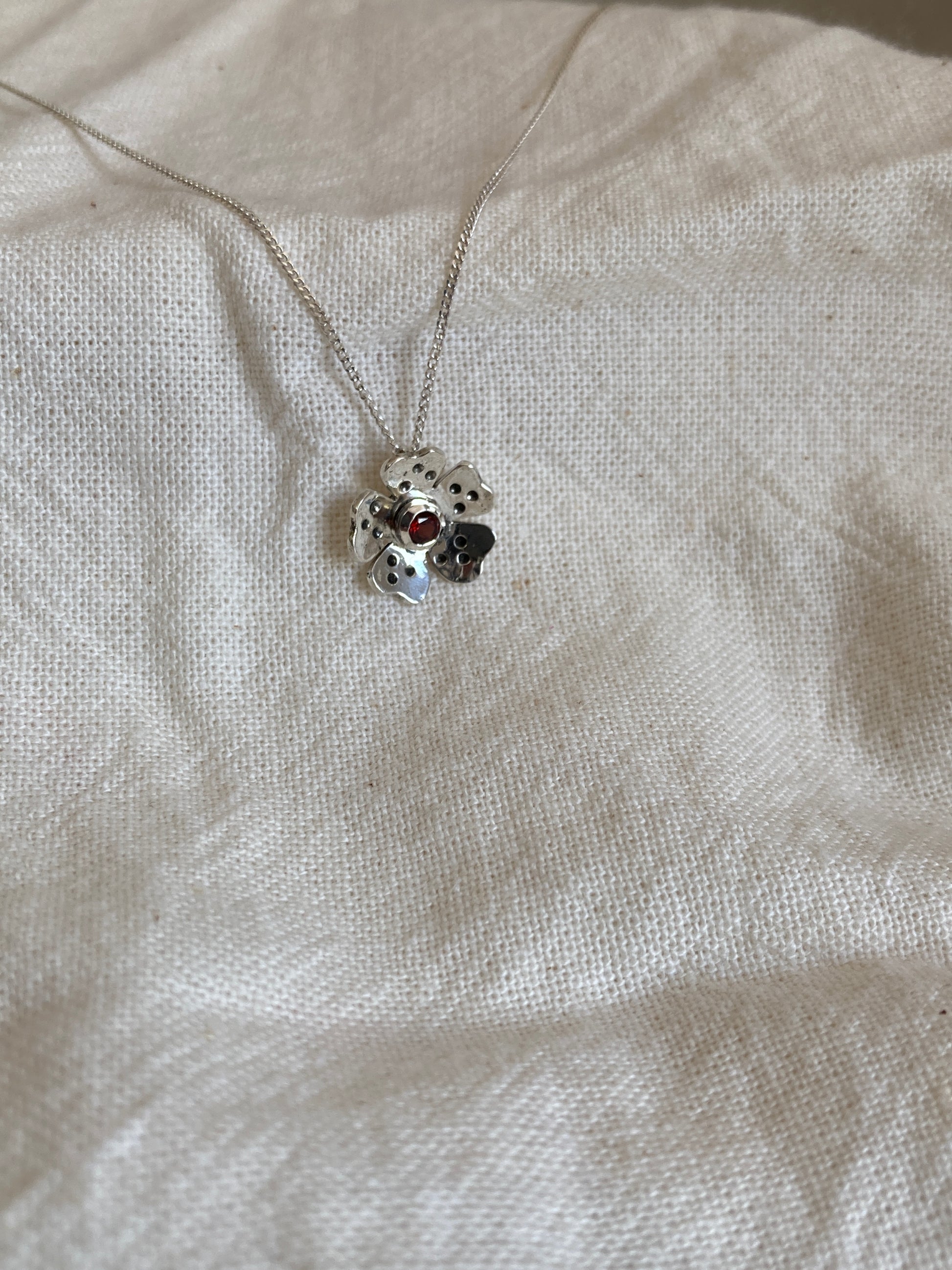 Sterling Silver Wild Flower Earrings with Garnet Stone in Centre