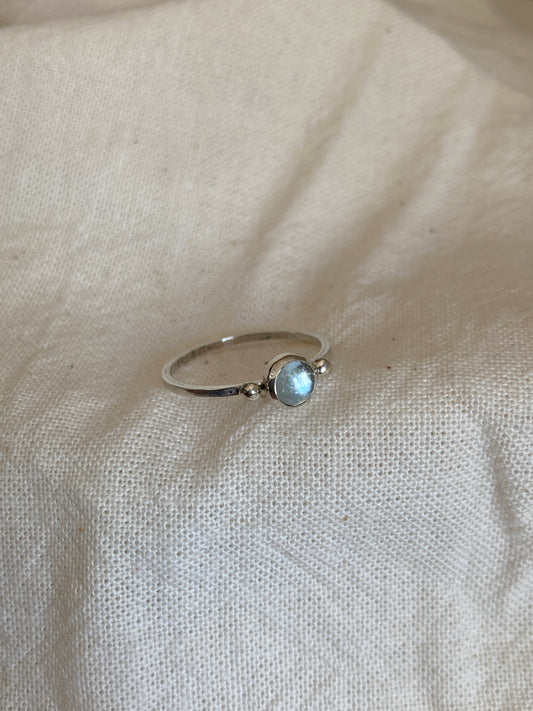 Sterling Silver Ring with two balls on either side of a Sky Blue Topaz Cabochon Stone