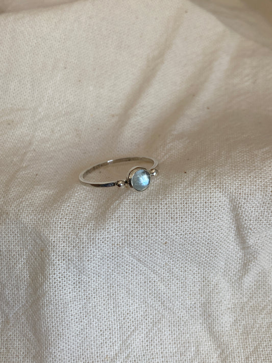 Sterling Silver Ring with two balls on either side of a Sky Blue Topaz Cabochon Stone