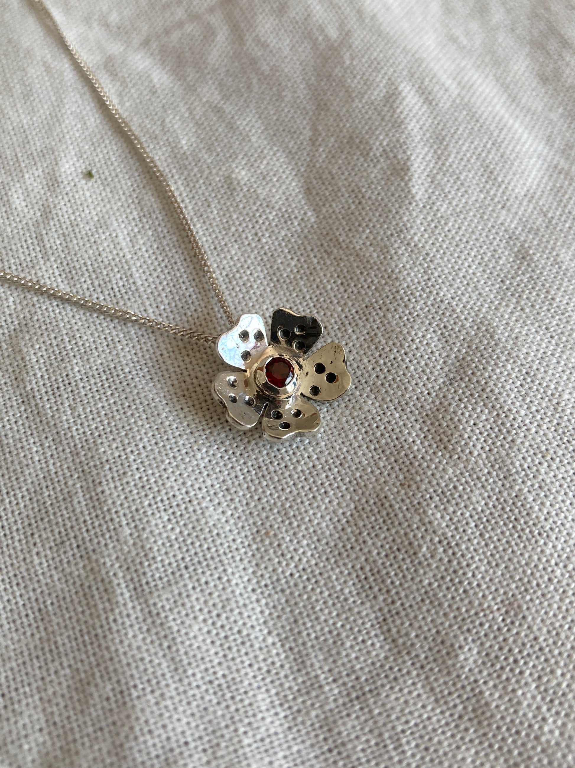 Sterling Silver Wild Flower Earrings with Garnet Stone in Centre