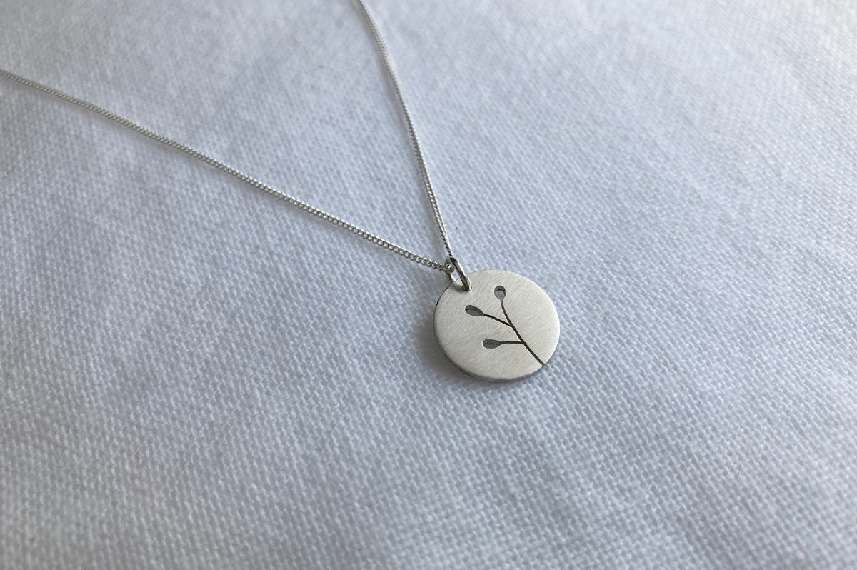 Sterling Silver Disc with Botanical cut-out on Silver Chain