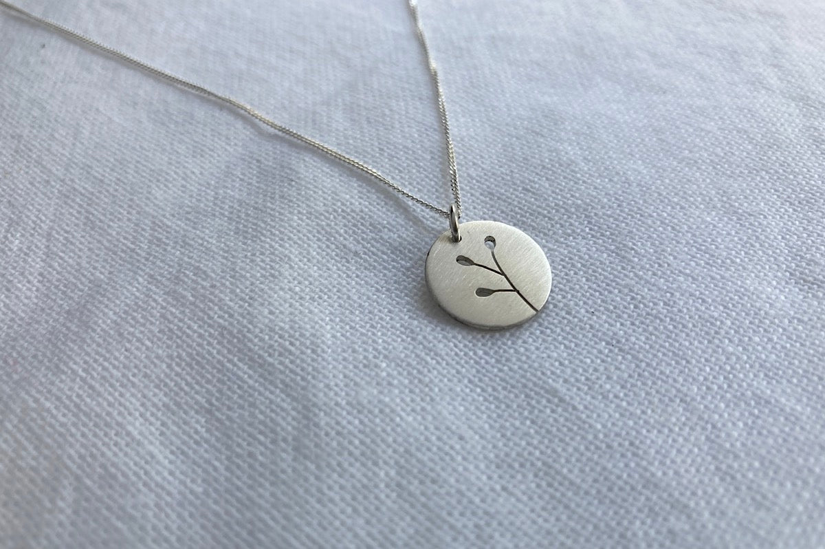 Sterling Silver Disc with Botanical cut-out on Silver Chain