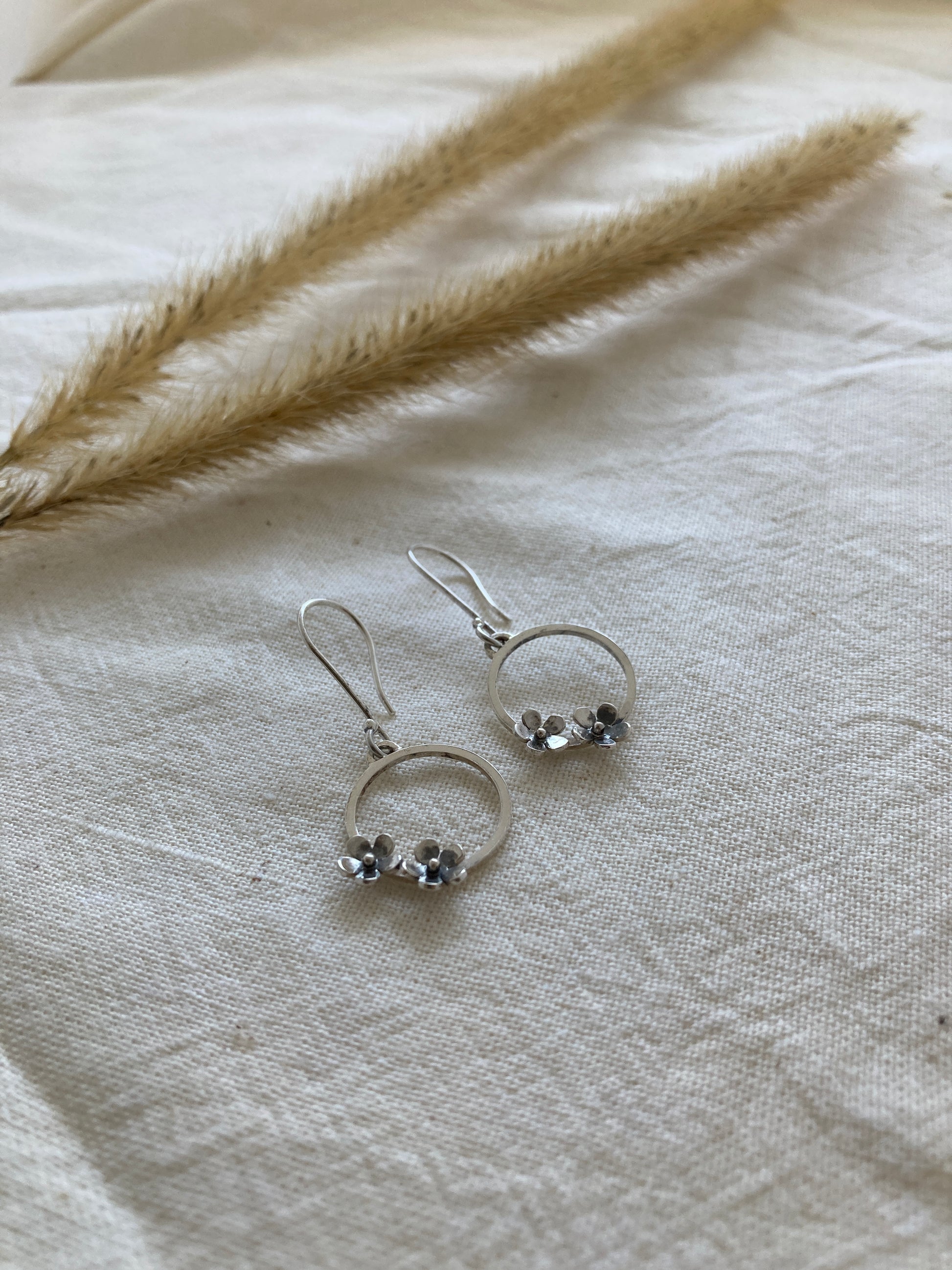 Sterling Silver Circle with two small Blooming Flowers on Silver Hook Earrings