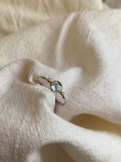 Sterling Silver Ring with two balls on either side of a Sky Blue Topaz Cabochon Stone
