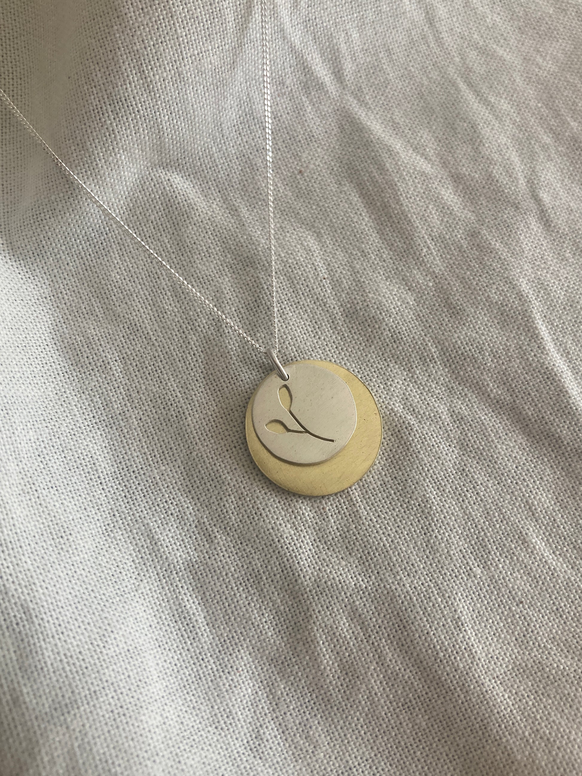 Sterling Silver Disc with Botanical cut-out and Brass Disc Pendant Set