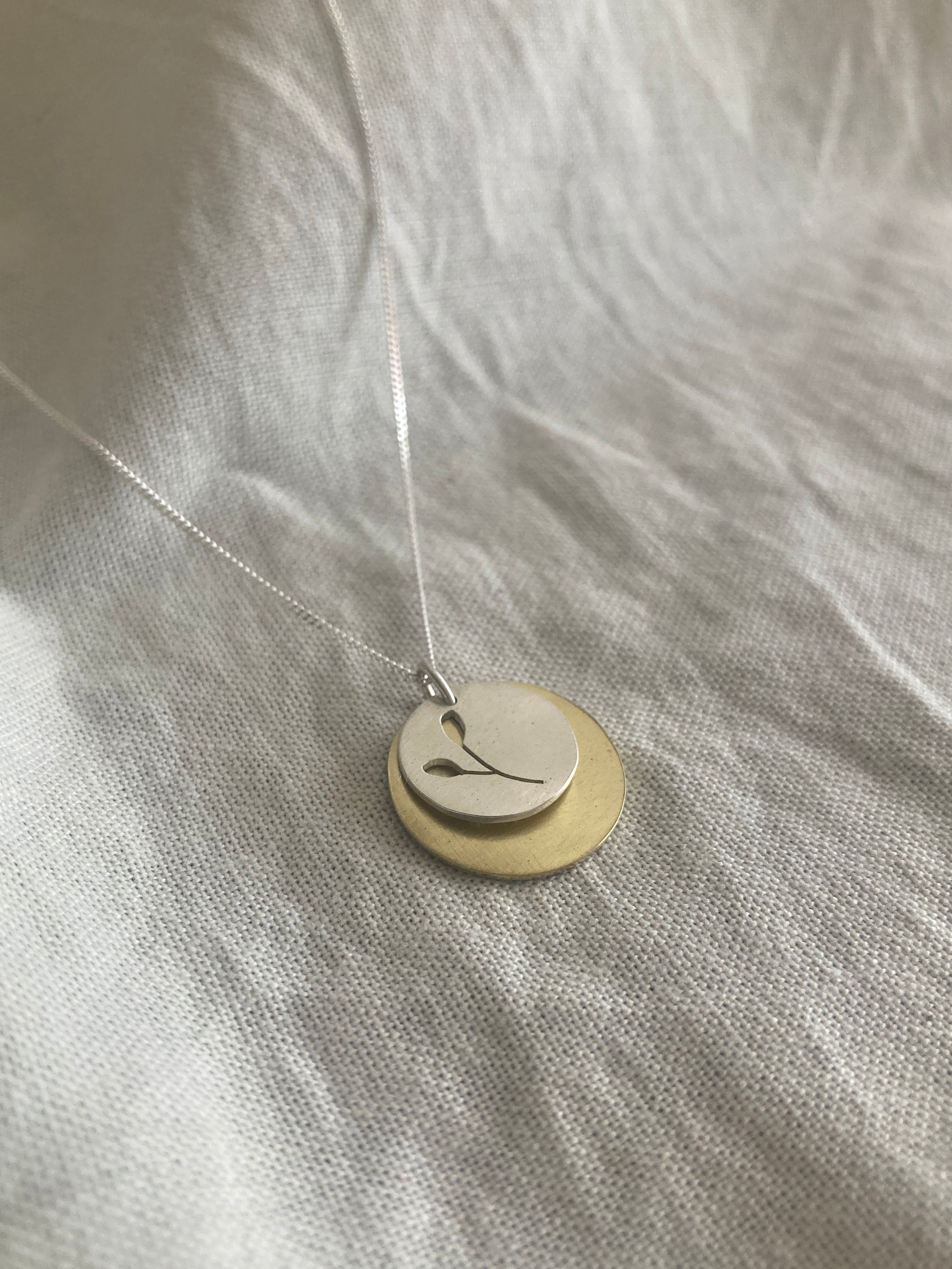 Sterling Silver Disc with Botanical cut-out and Brass Disc Pendant Set