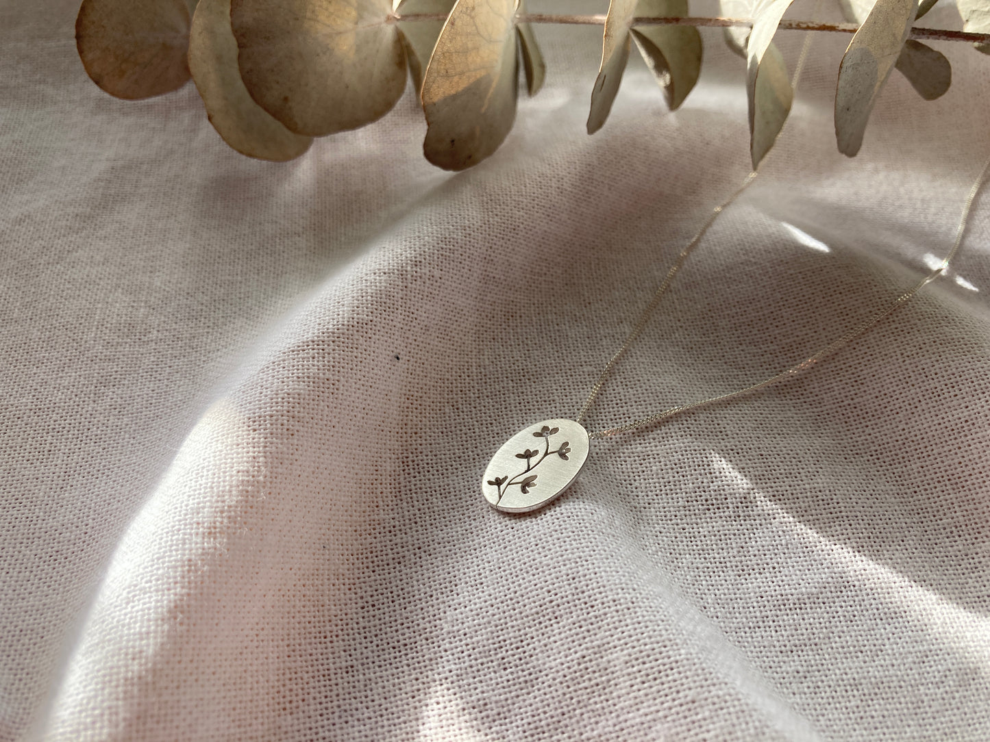 Sterling Silver Oval Pendant with Botanical cut-out inspired by flowers in Bloom on Silver Chain