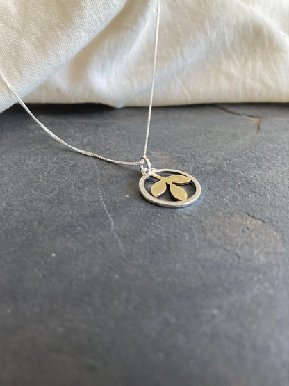 Sterling Silver Circle With Brass Leaves Pendant on Sterling Silver Chain