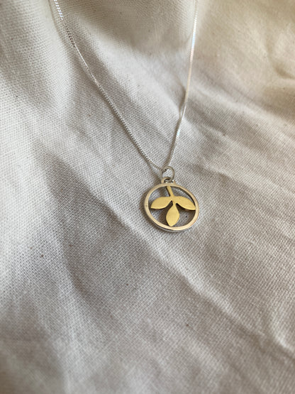 Sterling Silver Circle With Brass Leaves Pendant on Sterling Silver Chain