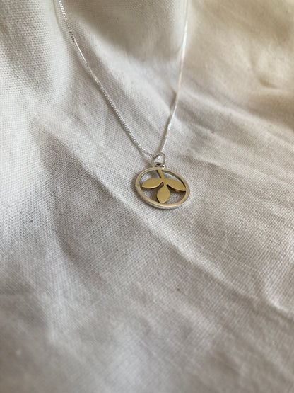 Sterling Silver Circle With Brass Leaves Pendant on Sterling Silver Chain