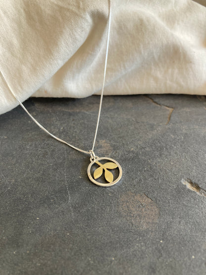 Sterling Silver Circle With Brass Leaves Pendant on Sterling Silver Chain