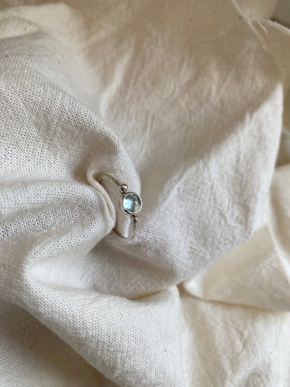 Sterling Silver Ring with two balls on either side of a Sky Blue Topaz Cabochon Stone