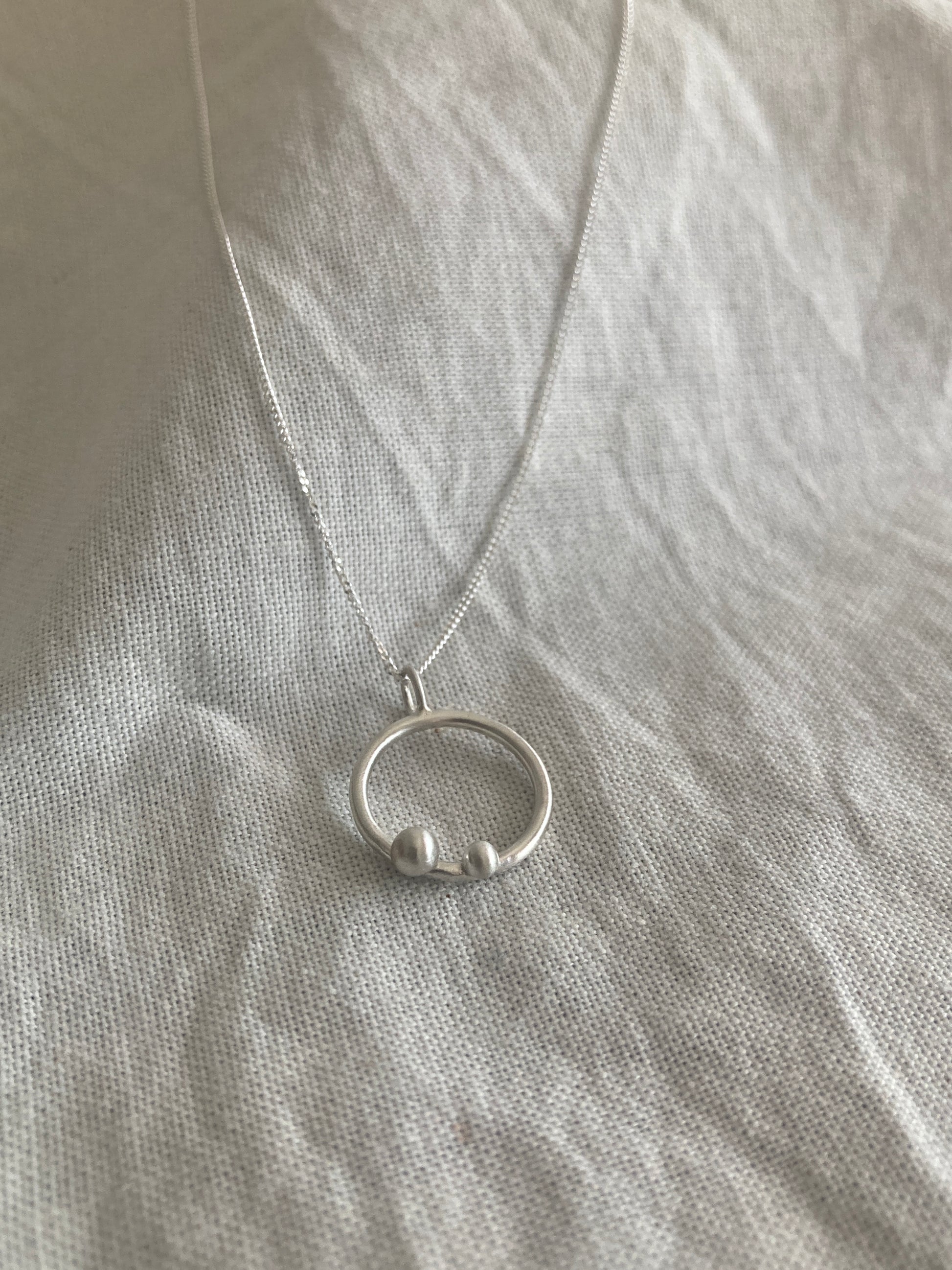 Sterling Silver Circle Pendant with Two Silver Balls on Sterling Silver Chain