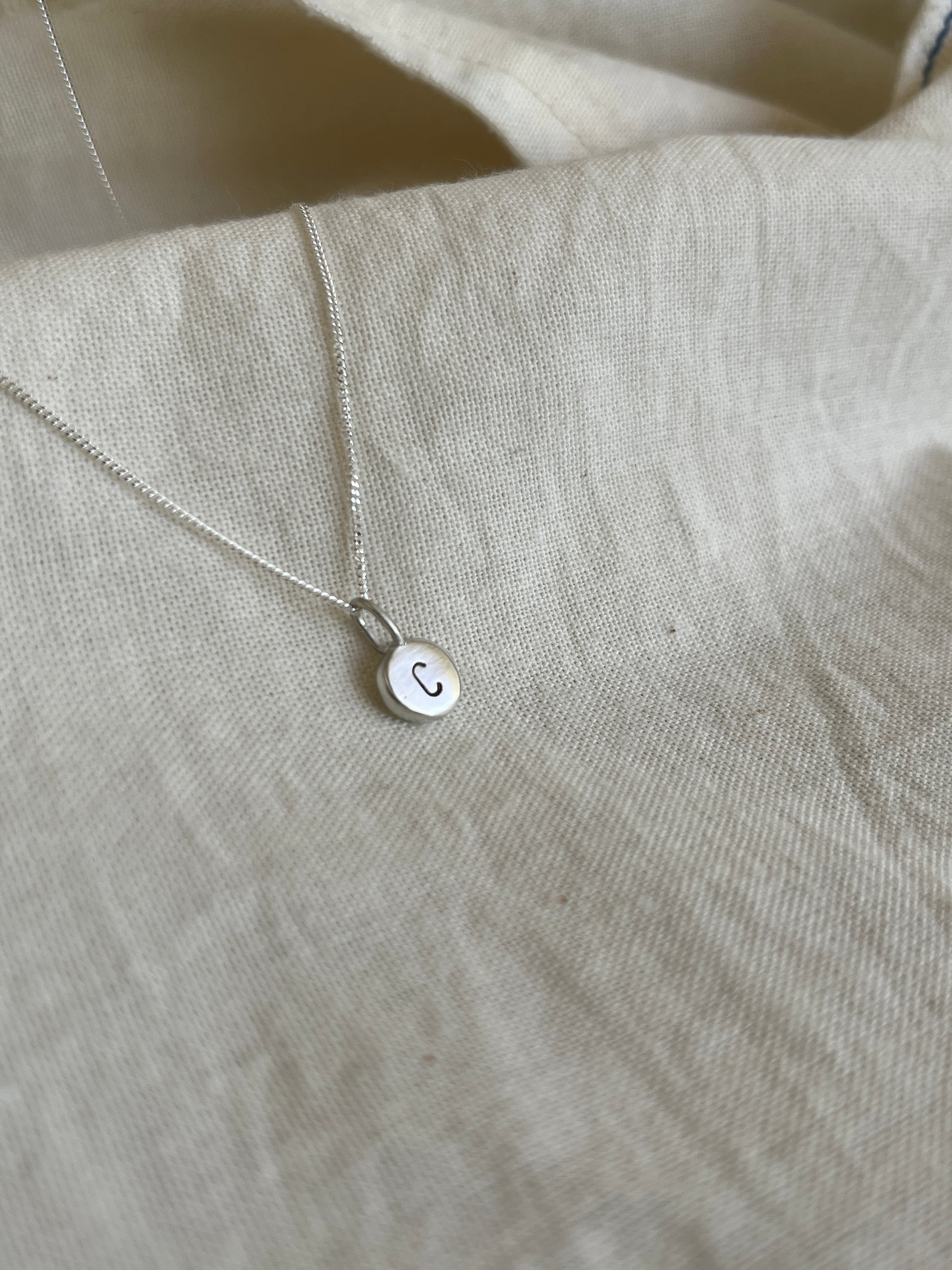 Sterling Silver Initial Pebble Pendant on Silver Chain