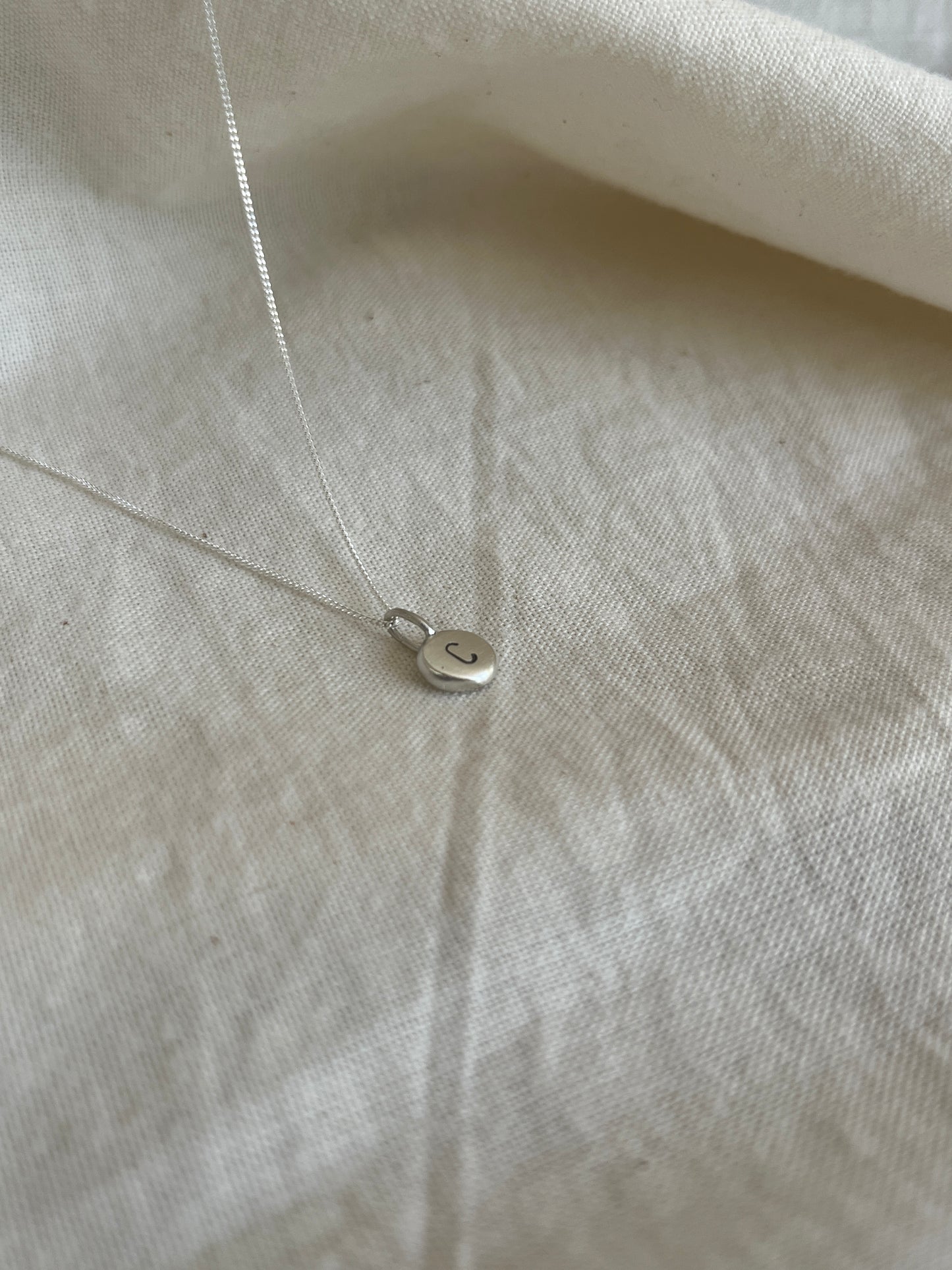 Sterling Silver Initial Pebble Pendant on Silver Chain