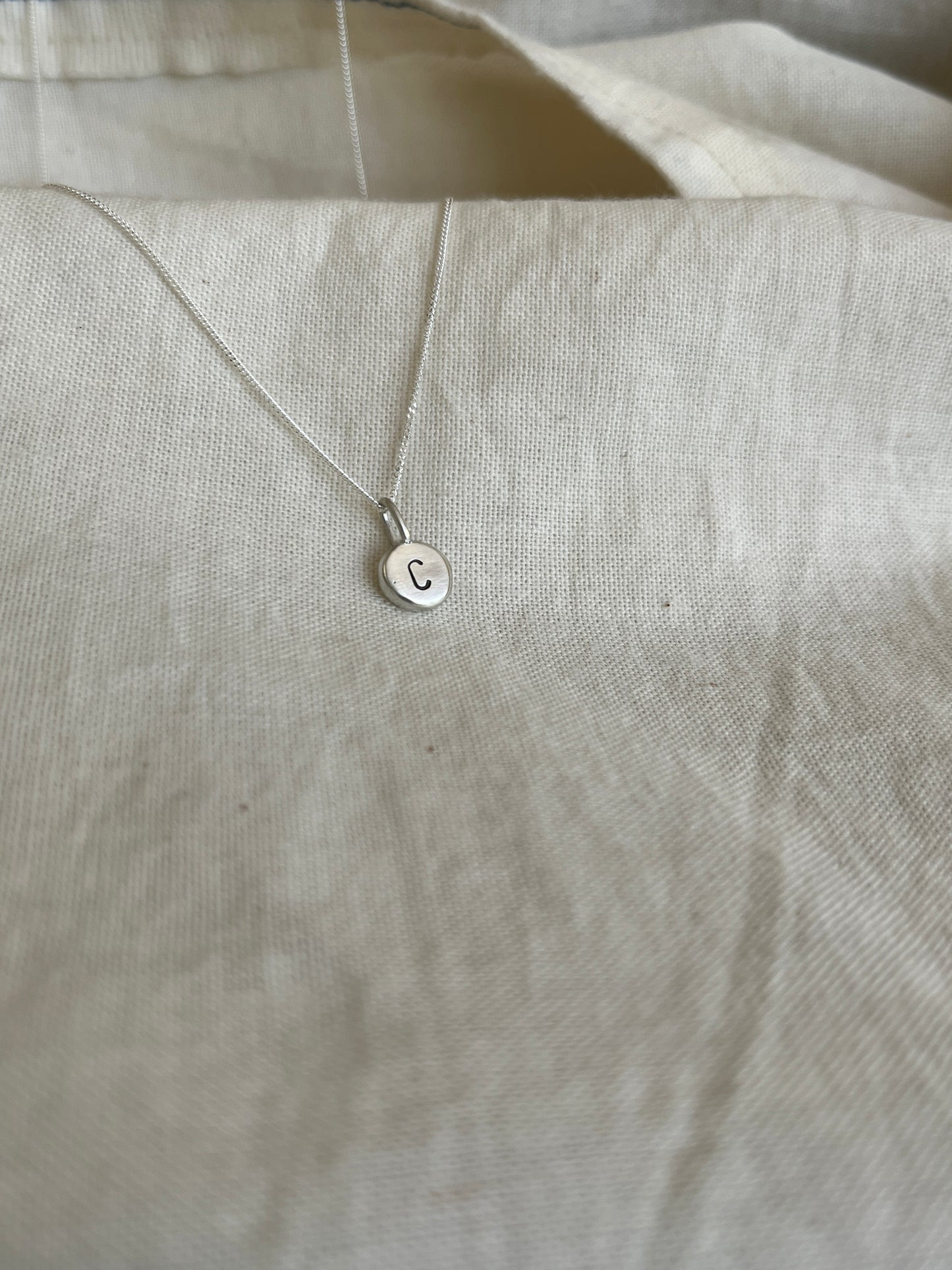 Sterling Silver Initial Pebble Pendant on Silver Chain