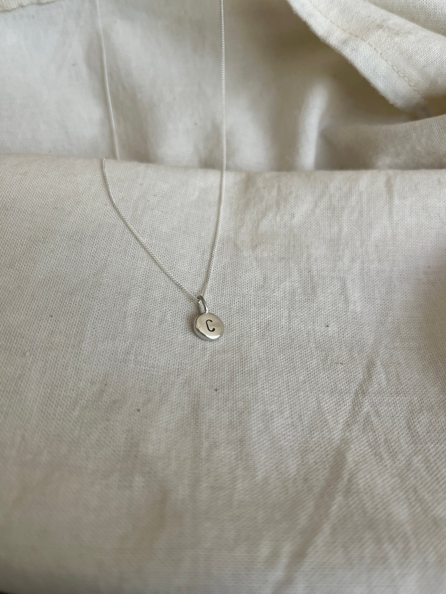 Sterling Silver Initial Pebble Pendant on Silver Chain