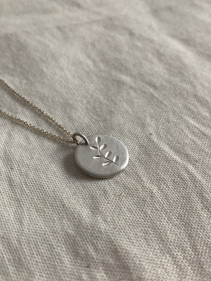 Sterling Silver Disc Pendant with engraved Leaves Design