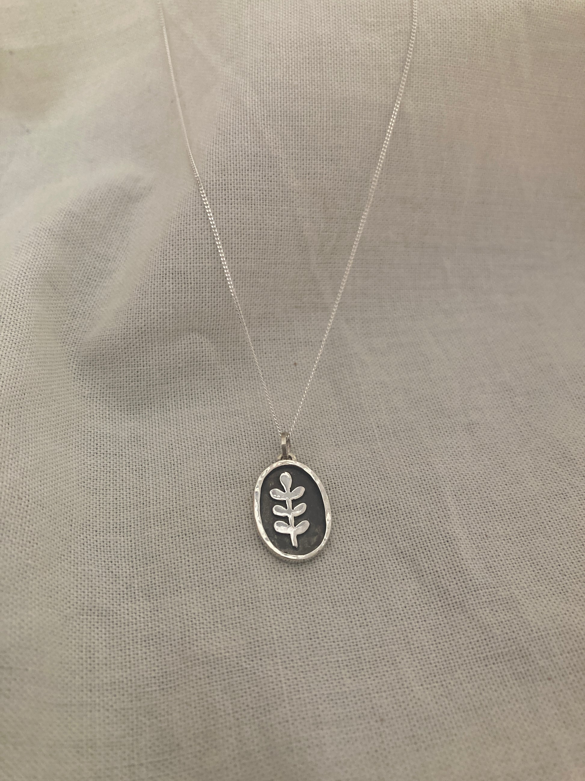 Sterling Silver Oval with Leaves Pendant with oxidised detail