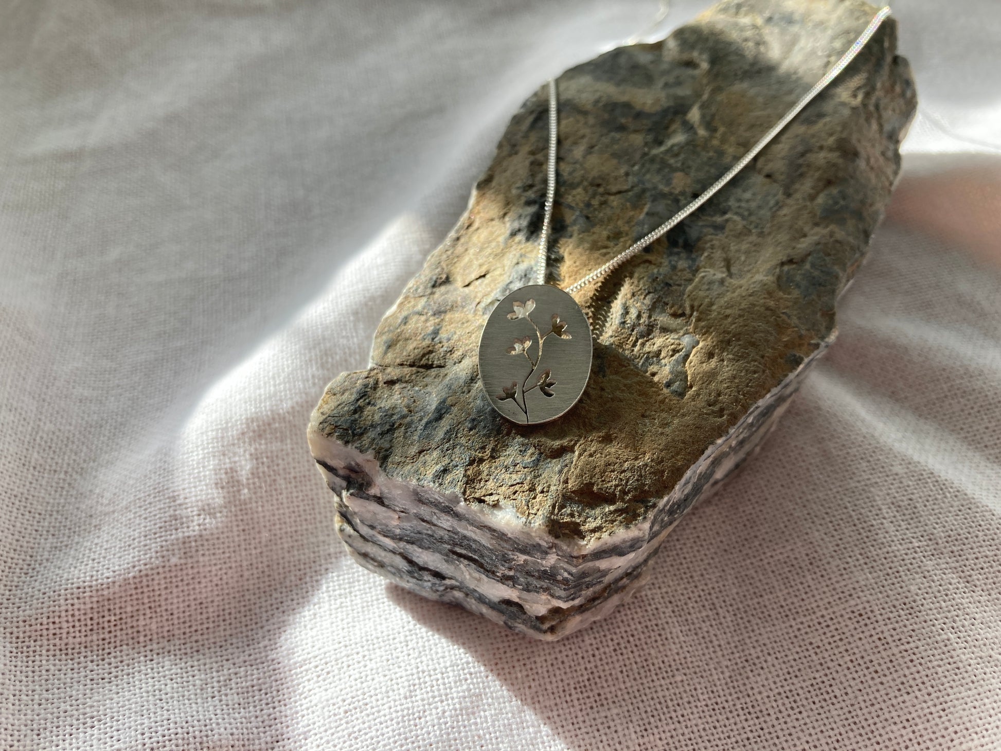 Sterling Silver Oval Pendant with Botanical cut-out inspired by flowers in Bloom on Silver Chain