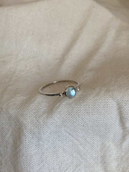 Sterling Silver Ring with two balls on either side of a Sky Blue Topaz Cabochon Stone