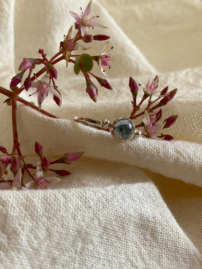Sterling Silver Ring with two balls on either side of a Sky Blue Topaz Cabochon Stone